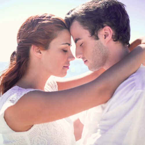 Happy,Couple,Hugging,Eyes,Closed,At,The,Beach